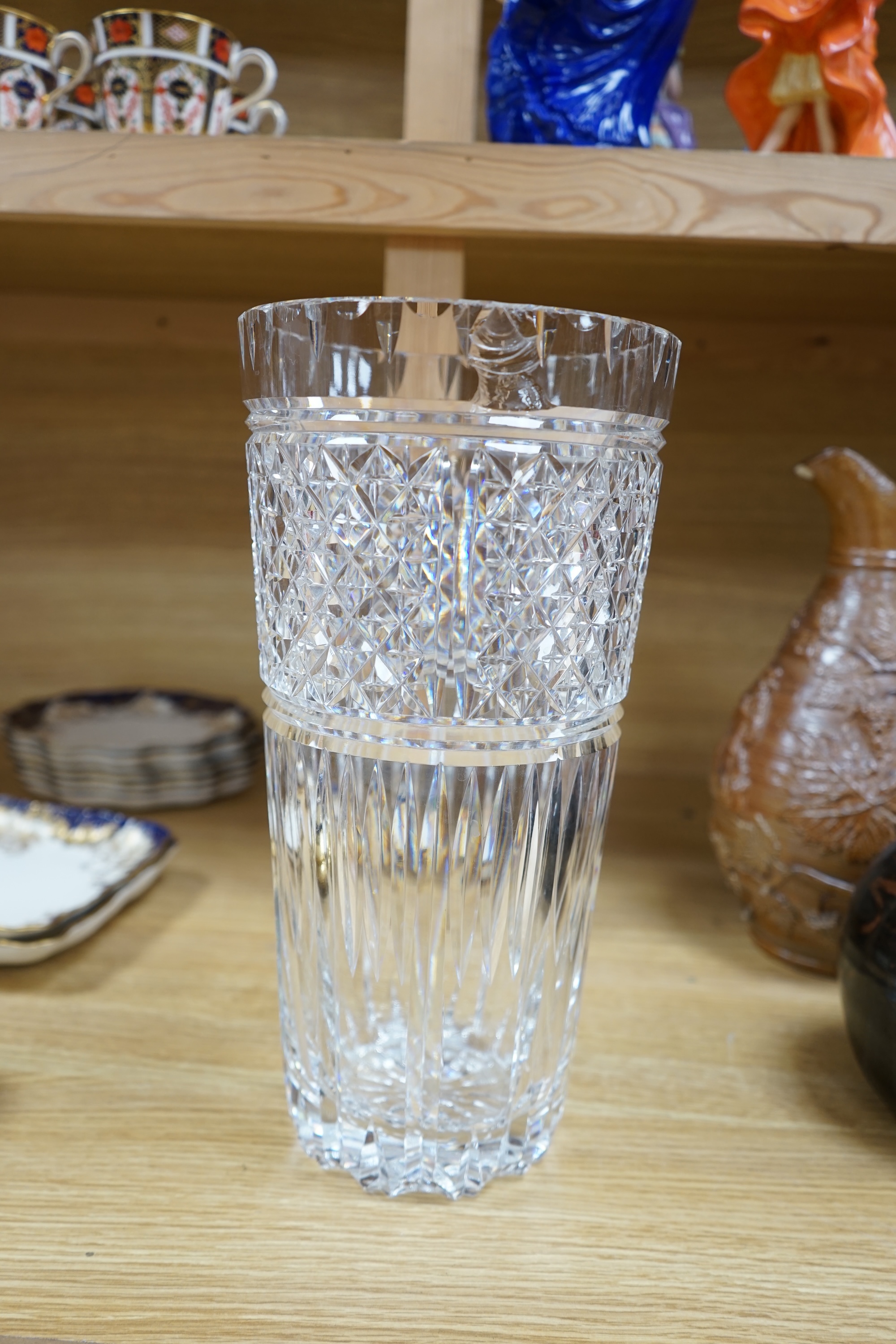 A large Waterford cut glass vase, 35cm high. Condition - chipped to top rim